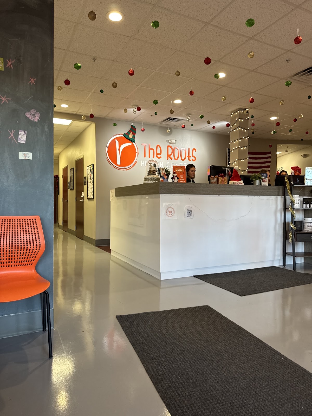The warm, welcoming Roots Health Centers front desk and reception area